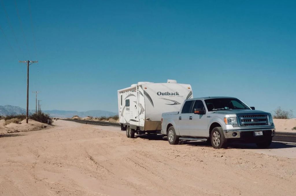 tow truck transferring a damaged rv